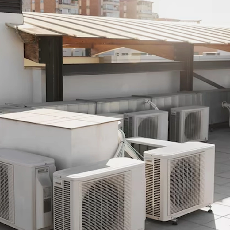 Multiple outdoor air conditioning units installed on a rooftop, showcasing large-scale HVAC systems for efficient ventilation and cooling in Greater Boston, MA.