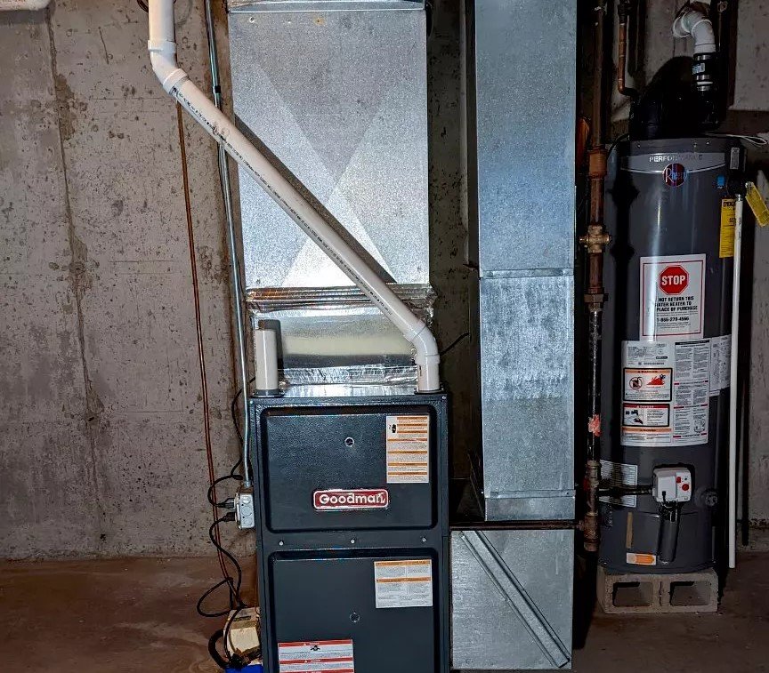 Installed Goodman furnace with an attached water heater, emphasizing reliable HVAC repair and heating services in Greater Boston.